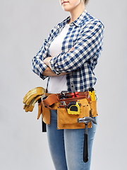 Image showing woman or builder with working tools on belt