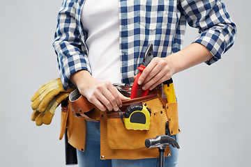 Image showing woman or builder with working tools on belt