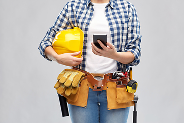 Image showing woman or builder with phone and working tools