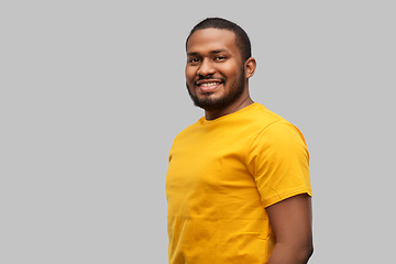 Image showing smiling african american man in yellow t-shirt