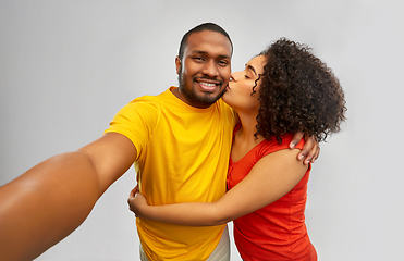 Image showing happy smiling african american couple takes selfie