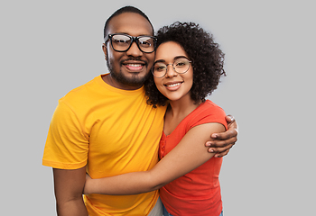 Image showing happy african american couple in glasses hugging