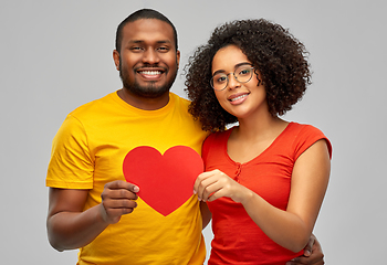 Image showing happy african american couple holding red heart