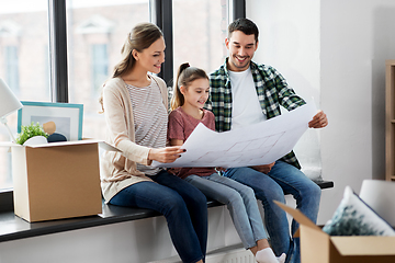 Image showing happy family with blueprint moving to new home