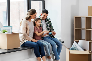 Image showing happy family with color palette moving to new home