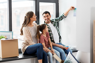 Image showing happy family with color palette moving to new home