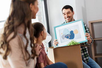 Image showing happy family with child moving to new home