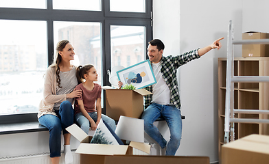 Image showing happy family with child moving to new home