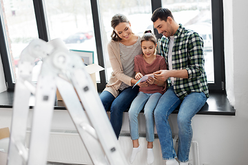 Image showing happy family with color palette moving to new home