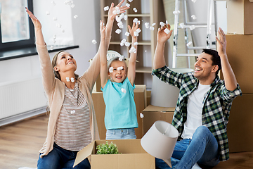 Image showing happy family playing with foam peanuts at new home