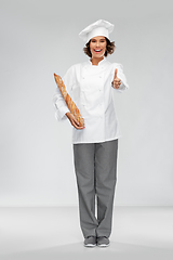 Image showing happy female chef with french bread or baguette