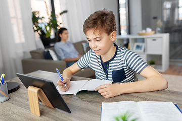 Image showing student boy with tablet computer learning at home