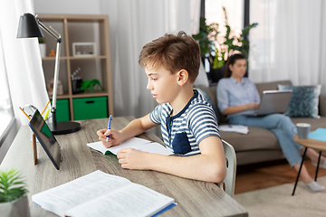 Image showing student boy with tablet computer learning at home