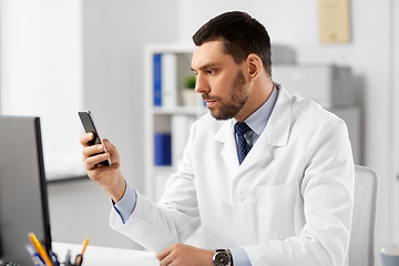 Image showing male doctor with smartphone at hospital