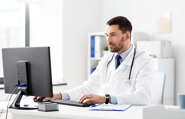 Image showing male doctor with computer working at hospital