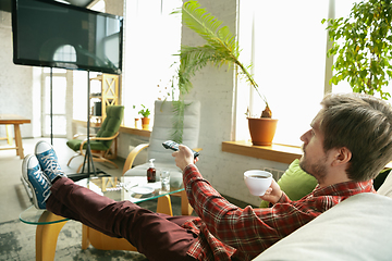 Image showing Caucasian man staying at home during quarantine because of coronavirus spreading