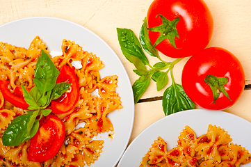 Image showing Italian pasta farfalle butterfly bow-tie and tomato sauce