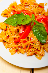 Image showing Italian pasta farfalle butterfly bow-tie and tomato sauce