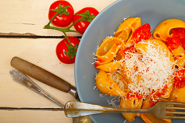 Image showing Italian snail lumaconi pasta with tomatoes