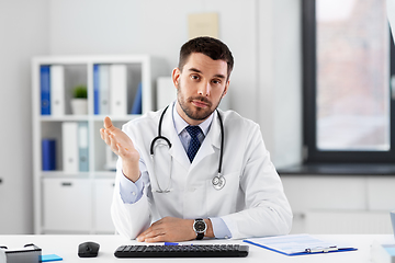 Image showing male doctor having video conference at hospital