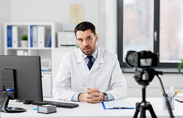 Image showing male doctor with recording video blog at hospital