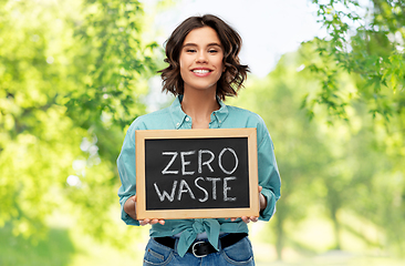 Image showing happy woman with chalkboard with zero waste words