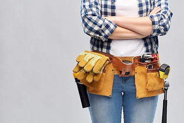 Image showing woman or builder with working tools on belt