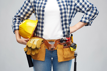 Image showing woman or builder with helmet and working tools