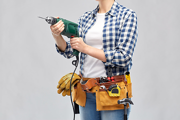 Image showing woman or builder with drill and work tools