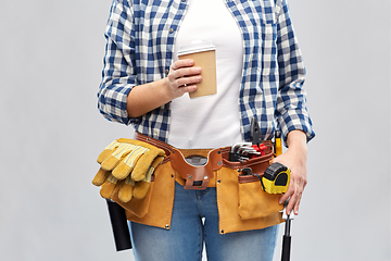 Image showing woman with takeaway coffee cup and working tools
