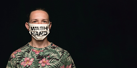 Image showing Man in protective mask with words WASH HANDS, coronavirus prevention, protection concept