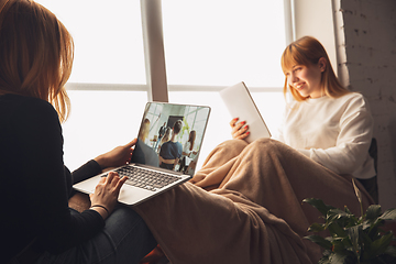 Image showing Young friends, women using gadgets to watch cinema, photos, online courses, taking selfie or vlog