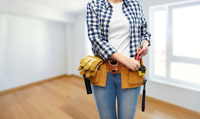 Image showing woman or builder with working tools on belt