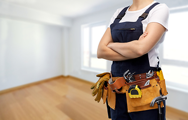 Image showing woman or builder with working tools on belt