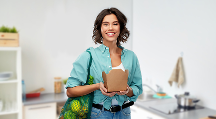 Image showing happy woman with food in reusable net bag and wok