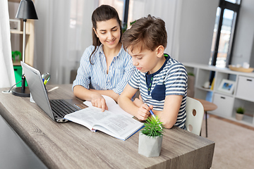 Image showing mother and son doing homework together