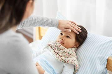 Image showing mother measuring temperature of sick daughter