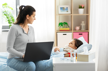 Image showing ill daughter and mother with laptop at home