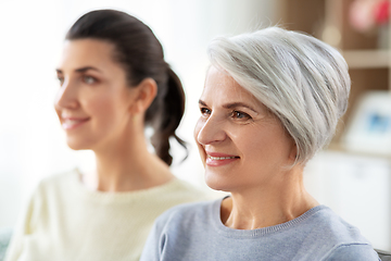 Image showing portrait of old mother and adult daughter at home