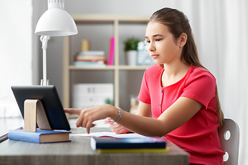 Image showing student girl with tablet pc learning at home