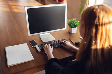 Image showing Caucasian young woman in business attire working in office