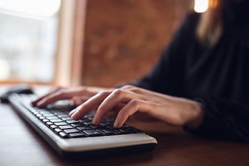 Image showing Caucasian young woman in business attire working in office