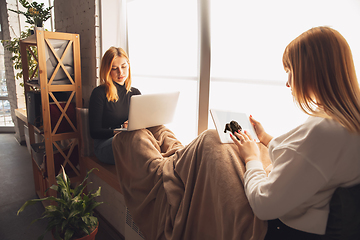 Image showing Young friends, women using gadgets to watch cinema, photos, online courses, taking selfie or vlog