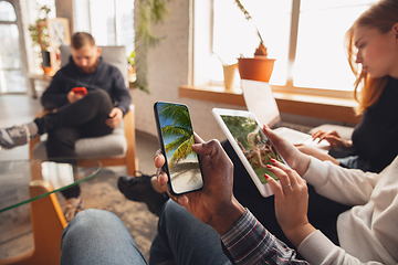 Image showing Young friends using gadgets to watch cinema, photos, online courses, taking selfie or vlog