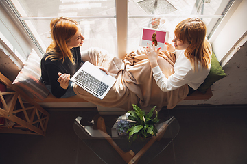 Image showing Young friends, women using gadgets to watch cinema, photos, online courses, taking selfie or vlog