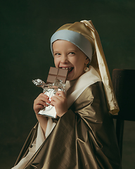 Image showing Medieval little girl as a lady with a pearl earring on dark studio background. Concept of comparison of eras, childhood. Stylish creative design, art vision, new look of artwork.