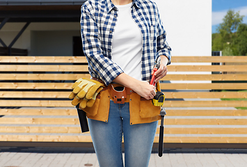 Image showing woman or builder with working tools on belt