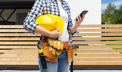 Image showing woman or builder with phone and working tools