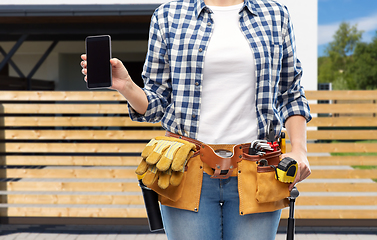 Image showing woman or builder with phone and working tools