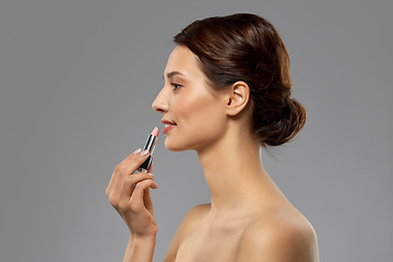 Image showing beautiful smiling young woman with pink lipstick